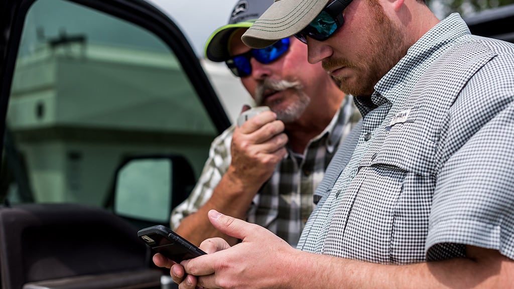 Customers accessing the John Deere Operations Center™ on a mobile device.