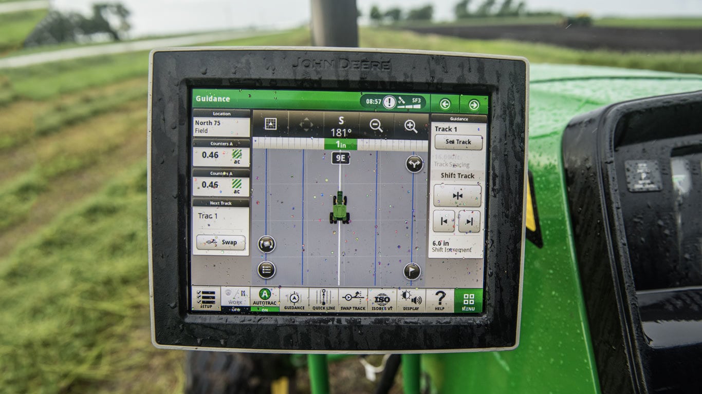 closeup of John Deere 4240 Universal Precision Ag display in a tractor cab